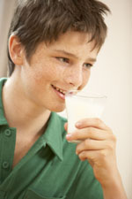 Teenage boy drinking milk